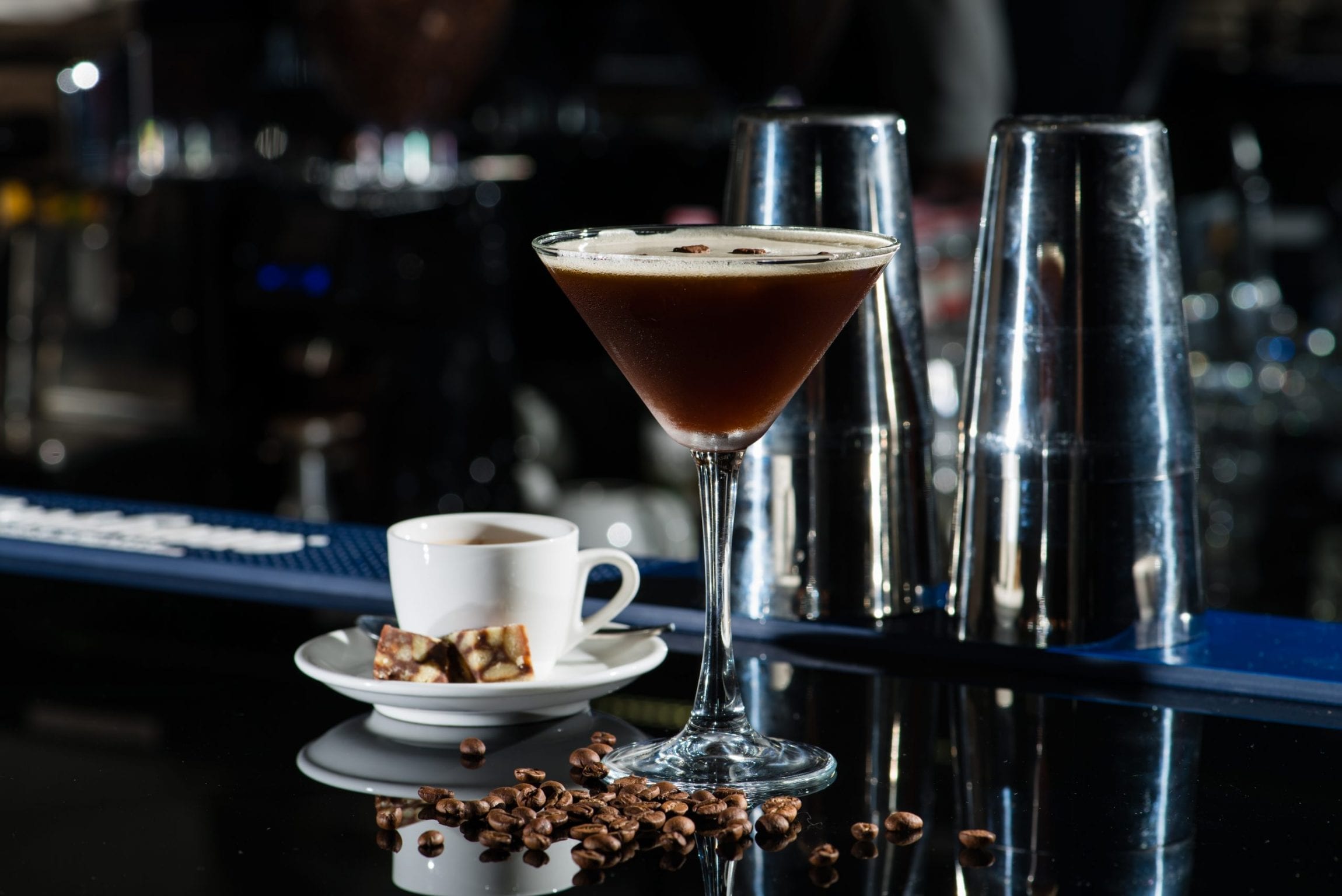 Fresh coffee cocktail with coffee beans and espresso at the bar