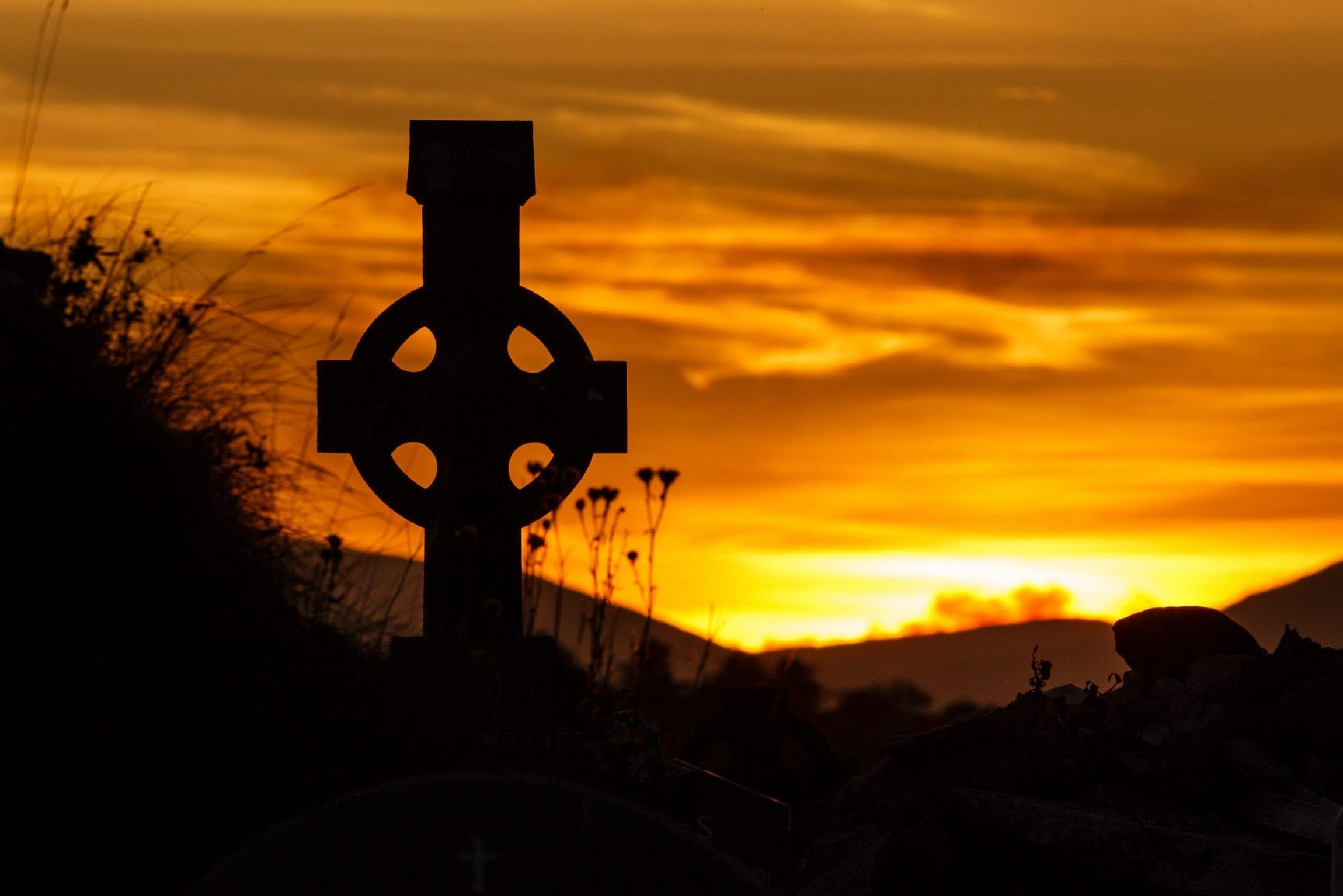 Silhouette of Celtic Cross at Sunset on the Dingle Peninsula, County Kerry, Ireland